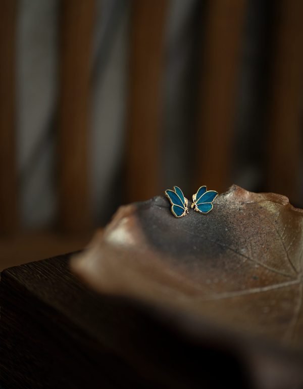 Butterfly earrings with peacock feather inlay